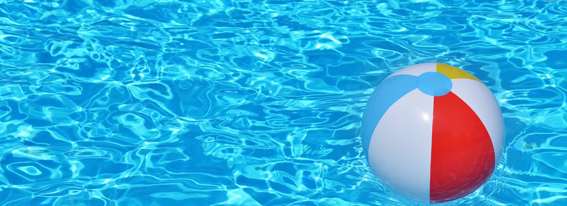 colorful inflatable ball floating in swimming pool